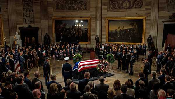 Vice President Kamala Harris (R), alongside US Second Gentleman Doug Emhoff, presents a wreath on behalf of the Executive Branch at the Lying in State Ceremony for former President Jimmy Carter at the US Capitol Rotunda in Washington, DC on January 7, 2025.