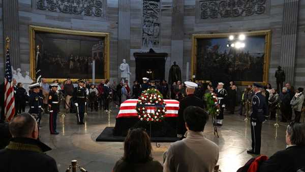 The public views the flag-draped casket of former President Jimmy Carter at the US Capitol Rotunda in Washington, DC on January 8, 2025.