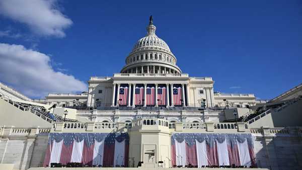 US flags are displayed on the West Front of the US Capitol building, where the presidential inauguration traditionally takes place, on January 17, 2025, in Washington, DC. US President-elect Donald Trump said on January 17, 2025 that his inauguration as US president on January 20 will be moved indoors due to expected freezing weather. Trump said he will deliver is inaugural address in the Rotunda of the US Capitol. (Photo by Mandel NGAN / AFP) (Photo by MANDEL NGAN/AFP via Getty Images)