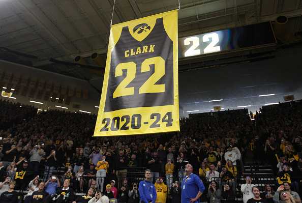 IOWA&#x20;CITY,&#x20;IOWA-&#x20;FEBRUARY&#x20;2&#x3A;&#x20;&#x20;A&#x20;banner&#x20;to&#x20;honor&#x20;former&#x20;Iowa&#x20;Hawkeye&#x20;guard&#x20;and&#x20;current&#x20;Indiana&#x20;Fever&#x20;guard&#x20;Caitlin&#x20;Clark&#x20;&#x23;22&#x20;is&#x20;hoisted&#x20;to&#x20;the&#x20;ceiling&#x20;during&#x20;a&#x20;ceremony&#x20;to&#x20;retire&#x20;her&#x20;&#x23;22&#x20;following&#x20;the&#x20;match-up&#x20;against&#x20;the&#x20;USC&#x20;Trojans,&#x20;at&#x20;Carver-Hawkeye&#x20;Arena&#x20;on&#x20;February&#x20;2,&#x20;2025&#x20;&#x20;in&#x20;Iowa&#x20;City,&#x20;Iowa.&#x20;&#x20;&#x28;Photo&#x20;by&#x20;Matthew&#x20;Holst&#x2F;Getty&#x20;Images&#x29;