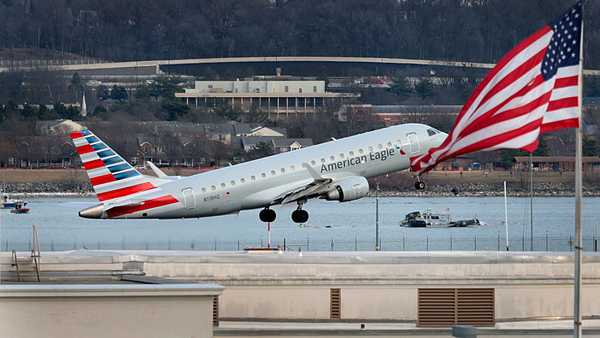 ARLINGTON, VIRGINIA - JANUARY 30: An American Airlines aircraft takes off from Ronald Reagan Washington National Airport as emergency workers continue to search the wreckage of the aircrafts that crashed into the Potomac River yesterday on January 30, 2025 in Arlington, Virginia.  Yesterday evening an American Airlines flight from Wichita, Kansas collided midair with a military Black Hawk helicopter while on approach to Ronald Reagan Washington National Airport outside of Washington, DC. According to reports, there were no survivors among the 67 people onboard both aircraft.  (Photo by Kayla Bartkowski/Getty Images)