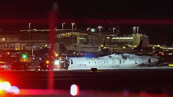 DELTA flight 4819 from Minneapolis is seen overturned on the runway after crashing while landing at Pearson International Airport (YYZ) in Toronto, Canada on February 17, 2025.