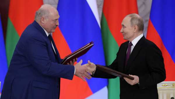 Russian President Vladimir Putin (R) exchanges documents with Belarusian President Alexander Lukashenko (L) during their bilateral meeting at the Grand Kremlin Palace, March 13, 2025, in Moscow, Russia.
