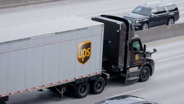 March 17, 2025 Spokane, Washington USA A UPS semi-truck, powered by Compressed Natural Gas, driving along an urban city-center freeway.