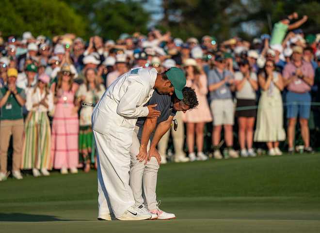 Masters&#x20;champion&#x20;Rory&#x20;McIlroy&#x20;of&#x20;Northern&#x20;Ireland&#x20;celebrates&#x20;with&#x20;caddie&#x20;Harry&#x20;Diamond&#x20;on&#x20;the&#x20;No.&#x20;18&#x20;green&#x20;after&#x20;a&#x20;sudden&#x20;death&#x20;playoff&#x20;against&#x20;Justin&#x20;Rose&#x20;of&#x20;England&#x20;to&#x20;win&#x20;the&#x20;Masters&#x20;at&#x20;Augusta&#x20;National&#x20;Golf&#x20;Club,&#x20;Sunday,&#x20;April&#x20;13,&#x20;2025.&#x20;&#x28;Photo&#x20;by&#x20;Ken&#x20;Griffey&#x20;Jr.&#x2F;Augusta&#x20;National&#x2F;Getty&#x20;Images&#x29;