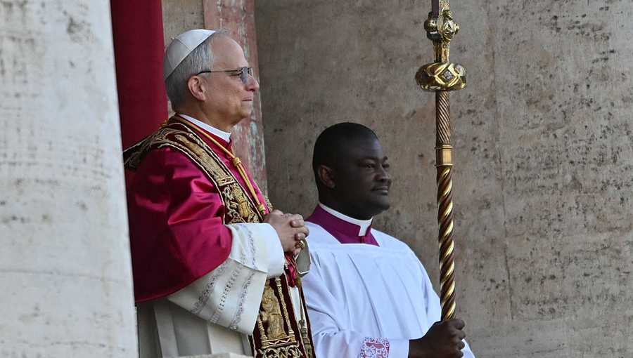 Newly elected Pope Robert Francis Prevost, Pope Leo XIV, (L) arrives on the main central loggia balcony of the St Peter&apos;s Basilica for the first time, after the cardinals ended the conclave, in The Vatican, on May 8, 2025. Robert Francis Prevost was on Thursday elected the first pope from the United States, the Vatican announced. A moderate who was close to Pope Francis and spent years as a missionary in Peru, he becomes the Catholic Church&apos;s 267th pontiff, taking the papal name Leo XIV. (Photo by Andrej ISAKOVIC / AFP) (Photo by ANDREJ ISAKOVIC/AFP via Getty Images)          