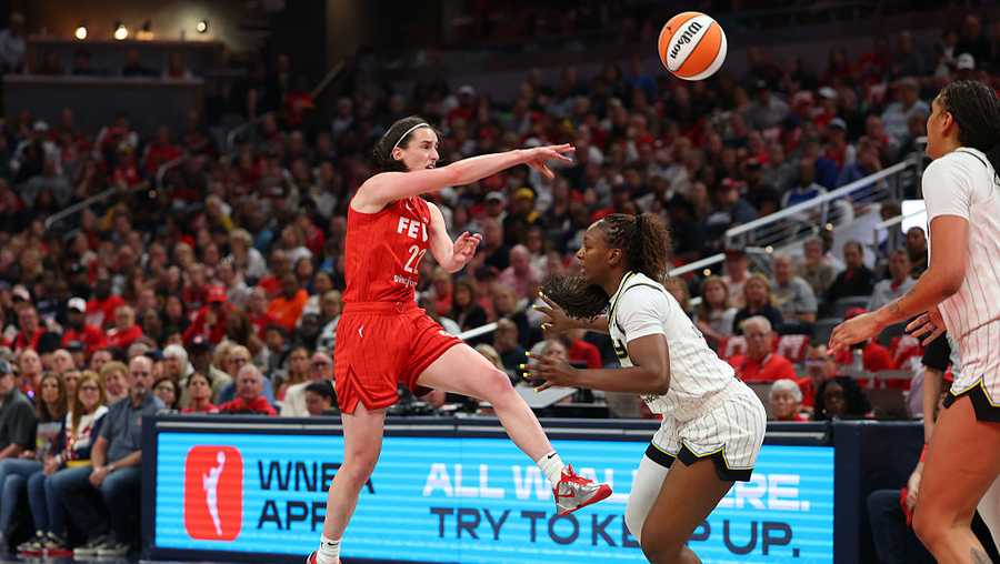 INDIANAPOLIS, INDIANA - MAY 17: Caitlin Clark #22 of the Indiana Fever passes over Michaela Onyenwere #12 of the Chicago Sky during the first half during the Fever&apos;s home opener at Gainbridge Fieldhouse on May 17, 2025 in Indianapolis, Indiana.