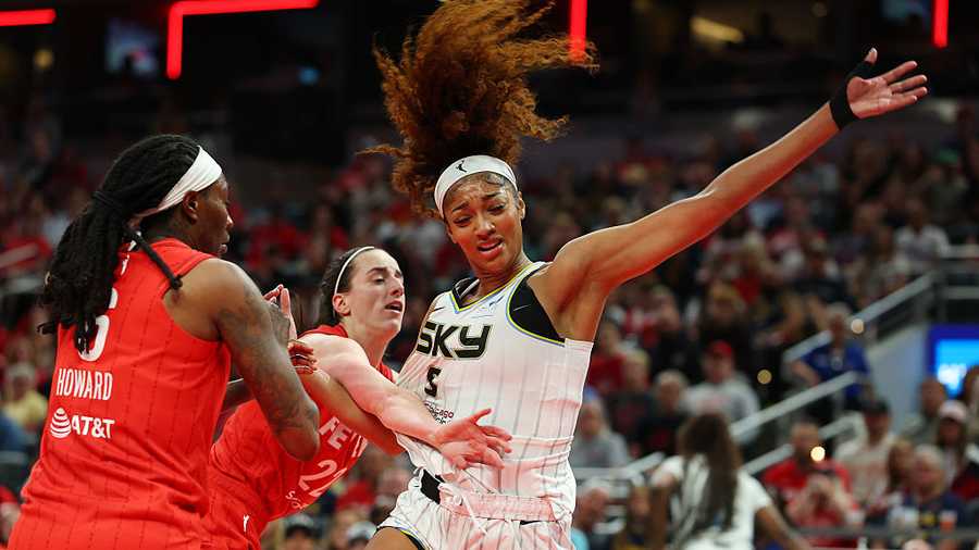 INDIANAPOLIS, INDIANA - MAY 17: Angel Reese #5 of the Chicago Sky takes a hard foul from Caitlin Clark #22 of the Indiana Fever in the second half during the Fever&apos;s home opener at Gainbridge Fieldhouse on May 17, 2025 in Indianapolis, Indiana.