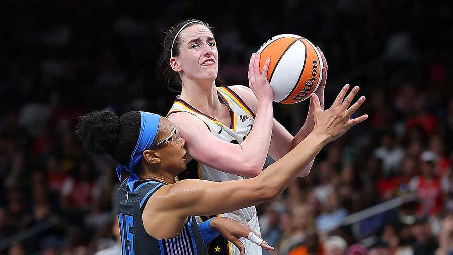 ATLANTA, GEORGIA - MAY 22:  Caitlin Clark #22 of the Indiana Fever draws a three-point foul from Allisha Gray #15 of the Atlanta Dream during the fourth quarter at State Farm Arena on May 22, 2025 in Atlanta, Georgia.  NOTE TO USER: User expressly acknowledges and agrees that, by downloading and/or using this photograph, user is consenting to the terms and conditions of the Getty Images License Agreement.  (Photo by Kevin C. Cox/Getty Images)