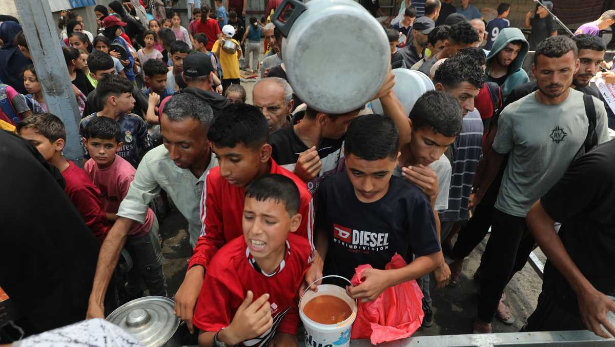 Israeli Fire Kills At Least 13 Palestinians Near Gaza Aid Sites
