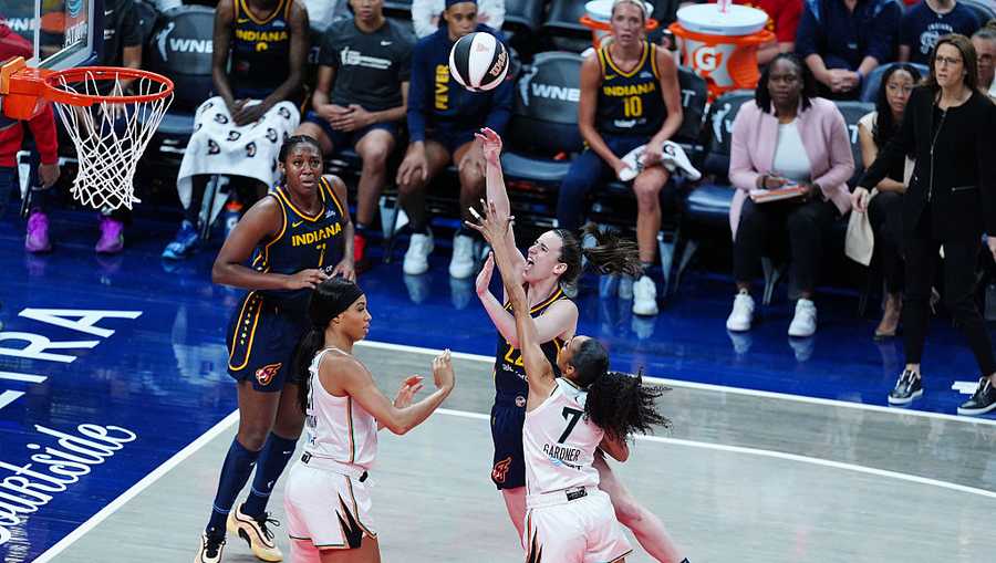 INDIANAPOLIS, IN - JUNE 14: Indiana Fever guard Caitlin Clark (22) takes a shot against New York Liberty guard Rebekah Gardner (7) on June 14, 2025, at Gainbridge Fieldhouse in Indianapolis, Indiana. (Photo by Brian Spurlock/Icon Sportswire via Getty Images)