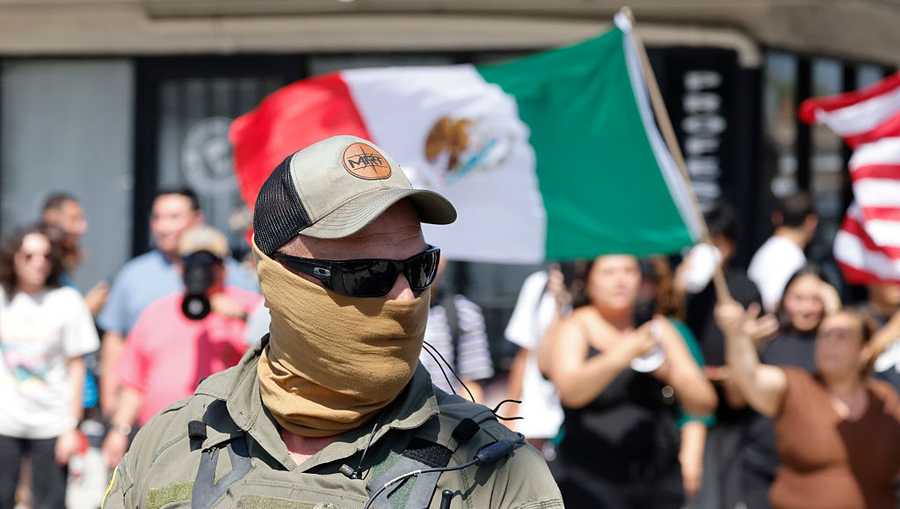 Citizens clash with US Border Patrol after a traffic collision with one of their vehicles on Atlantic and Brompton as ongoing immigration raids take place across the greater LA area on Friday, June 20, 2025 in Bell, CA.