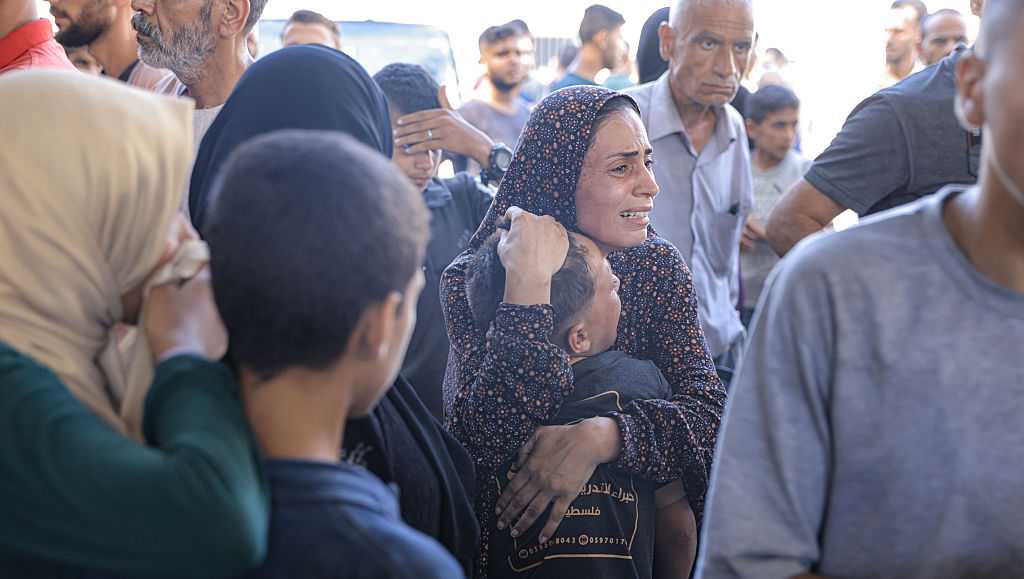 67 killed in Gaza as Israeli forces strike a cafe and fire on people seeking food