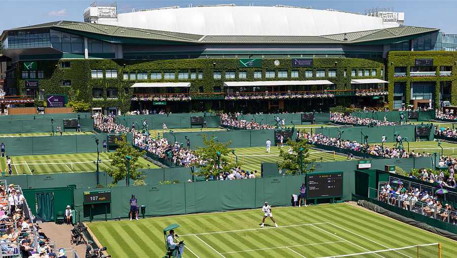 LONDON, ENGLAND - JUNE 30: A general panoramic view of the start of play on day one on the outside courts, packed with spectators as as Frances Tiafoe of the United States plays against Elmer Moller of Denmark in the first round of the Gentlemen&apos;s Singles Competition on No.12 Court  during the Wimbledon Lawn Tennis Championships at the All England Lawn Tennis and Croquet Club at Wimbledon  on June 30th, 2025, in London, England. (Photo by Tim Clayton/Getty Images)