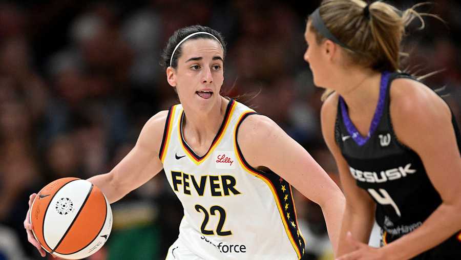 BOSTON, MASSACHUSETTS - JULY 15: Caitlin Clark #22 of the Indiana Fever drives to the basket against Jacy Sheldon #4 of the Connecticut Sun during the first half at the TD Garden on July 15, 2025 in Boston, Massachusetts. NOTE TO USER: User expressly acknowledges and agrees that, by downloading and/or using this Photograph, user is consenting to the terms and conditions of the Getty Images License Agreement. (Photo by Brian Fluharty/Getty Images)