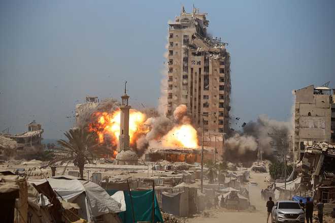 A&#x20;ball&#x20;of&#x20;fire&#x20;erupts&#x20;from&#x20;Mushtaha&#x20;Tower&#x20;as&#x20;it&#x20;is&#x20;destroyed&#x20;in&#x20;an&#x20;Israeli&#x20;airstrike&#x20;in&#x20;Gaza&#x20;City,&#x20;on&#x20;September&#x20;5,&#x20;2025.&#x20;&#x28;Photo&#x20;by&#x20;Majdi&#x20;Fathi&#x2F;NurPhoto&#x20;via&#x20;Getty&#x20;Images&#x29;