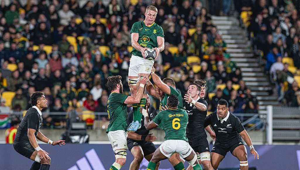 A crowd of people watching a rugby match at M&T Bank Stadium in Baltimore.