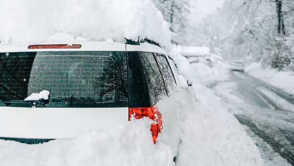 Car buried under deep snow after heavy snowfall