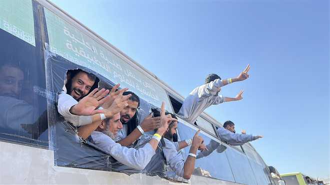 Palestinian&#x20;prisoners&#x20;released&#x20;through&#x20;the&#x20;International&#x20;Committee&#x20;of&#x20;the&#x20;Red&#x20;Cross&#x20;enter&#x20;the&#x20;Gaza&#x20;Strip&#x20;by&#x20;buses&#x20;through&#x20;the&#x20;Kerem&#x20;Abu&#x20;Salem&#x20;Border&#x20;Gate&#x20;and&#x20;are&#x20;first&#x20;taken&#x20;to&#x20;the&#x20;Moraj&#x20;area&#x20;north&#x20;of&#x20;Rafah&#x20;before&#x20;being&#x20;transported&#x20;to&#x20;Nasser&#x20;Hospital&#x20;in&#x20;Khan&#x20;Yunis&#x20;for&#x20;medical&#x20;checkups&#x20;in&#x20;Rafah,&#x20;Gaza,&#x20;on&#x20;October&#x20;13,&#x20;2025.