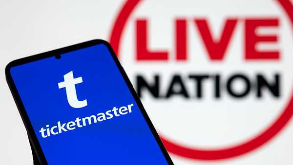 The Ticketmaster logo is displayed on a mobile phone with the Live Nation logo seen in the background in this photo illustration in Brussels, Belgium, on October 25, 2025. (Photo by Jonathan Raa/NurPhoto via Getty Images)