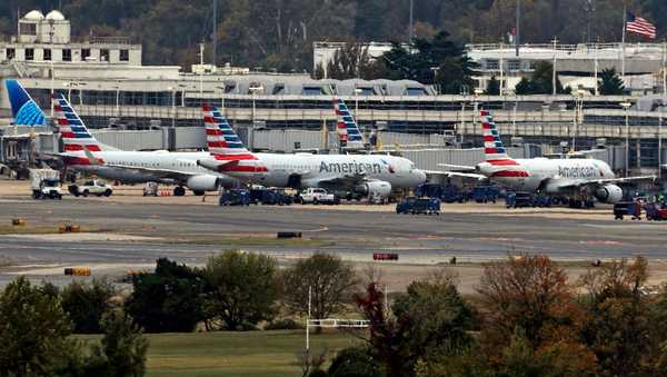 WASHINGTON, DC - OCTOBER 28:  Aircrafts park at Ronald Reagan Washington National Airport on October 28, 2025 as seen from Washington, DC. A nationwide staffing shortage of air traffic controller has led to many flight delays since the government shutdown on October 1.  (Photo by Alex Wong/Getty Images)