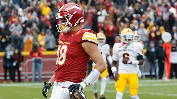 AMES, IOWA - NOVEMBER 1: Tight end Benjamin Brahmer #18 of the Iowa State Cyclones runs in a touchdown as defensive back Adrian Wilson #6 of the Arizona State Sun Devils defends in the first half of play at Jack Trice Stadium on November 1, 2025, in Ames, Iowa. (Photo by David Purdy/Getty Images)