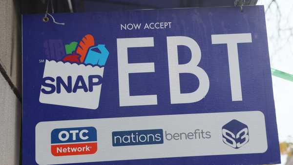 NEW YORK, NEW YORK - OCTOBER 30: An EBT sign is displayed on the window of a grocery store on October 30, 2025 in the Flatbush neighborhood of the Brooklyn borough in New York City.  Supplemental Nutrition Assistance Program (SNAP) benefits and other assistance are set to stop on November 1st amid a federal government shutdown that has been going on for 29 days and is the second-longest shutdown in the nation's history. New York Gov. Kathy Hochul declared a state of emergency for extra emergency funds and personnel to be deployed, as SNAP payments will be suspended. About 42 million Americans are expected to lose access to their benefits. (Photo by Michael M. Santiago/Getty Images)