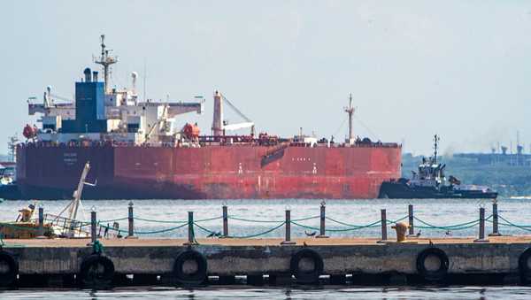 A crude oil tanker is anchored on Lake Maracaibo near Maracaibo, Zulia state, Venezuela, on December 18, 2025. Venezuela struck a defiant note on December 17, insisting that its crude oil exports were not impacted by US President Donald Trump's announcement of a potentially crippling blockade. (Photo by Alejandro Paredes / AFP via Getty Images)