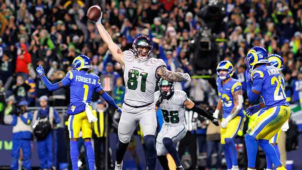 SEATTLE, WASHINGTON - DECEMBER 18: Eric Saubert #81 of the Seattle Seahawks celebrates after scoring the two-point conversion during overtime of an NFL football game against the Los Angeles Rams at Lumen Field on December 18, 2025 in Seattle, Washington. (Photo by Brooke Sutton/Getty Images)