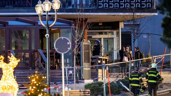 TOPSHOT - Rescuers are seen at the site of a fire that ripped through the bar Le Constellation in Crans-Montana on January 1, 2026. Several dozen people are presumed dead and around 100 injured after a fire ripped through a crowded bar in the luxury Swiss ski resort of Crans-Montana, Swiss police said on January 1, 2026. Police, firefighters and rescuers rushed to the popular resort, which is set to host the Ski World Cup from January 30, after the fire broke out in the early hours of New Year's Day. (Photo by MAXIME SCHMID / AFP via Getty Images)