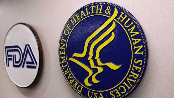 The seals of the US Food and Drug Administratio (FDA) and US Department of Health and Human Services are seen during a news conference with Medicare and Medicaid Administrator nominee Mehmet Oz to discuss fraud prevention on January 9, 2026, in Los Angeles, California. (Photo by Patrick T. Fallon / AFP via Getty Images)