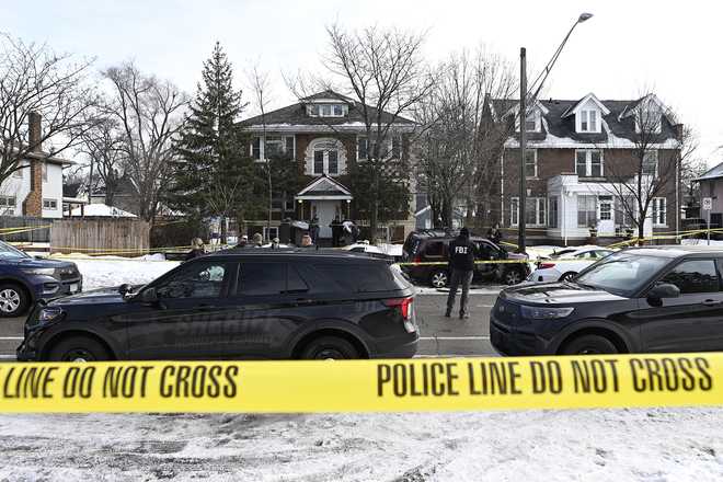 Members of law enforcement work the scene following a suspected shooting by an ICE agent during federal law enforcement operations on Jan. 7, 2026, in Minneapolis, Minnesota.