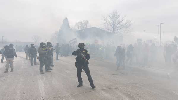 Federal agents clash with protesters outside an Immigration and Customs Enforcement (ICE) facility in Minneapolis, Minnesota, during a demonstration over the fatal shooting of Renee Nicole Good, a 37-year-old woman who was killed by a U.S. ICE agent, on January 15, 2026.
