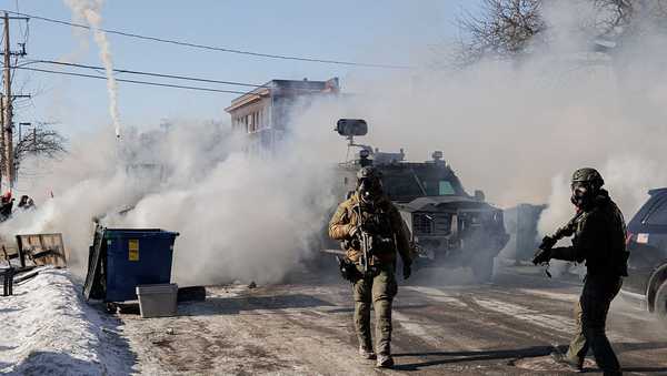 Federal agents deploy gas after an agent shot and killed a man nearby earlier in, Minnesota, US, on January 24, 2026.