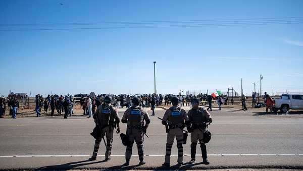 Texas State Troopers secure the area after dispersing a crowd protesting Immigration and Customs Enforcement at the South Texas Family Residential Center on January 28, 2026 in Dilley, Texas. A federal judge temporarily blocked the deportation of 5-year-old Liam Conejo Ramos and his father, Adrian Conejo Arias, who were arrested in Minneapolis after the father had picked the boy up from school. They were then taken to the South Texas Family Residential Center, an immigration detention center outside San Antonio, where they remain. (Photo by Joel Angel Juarez/Getty Images)