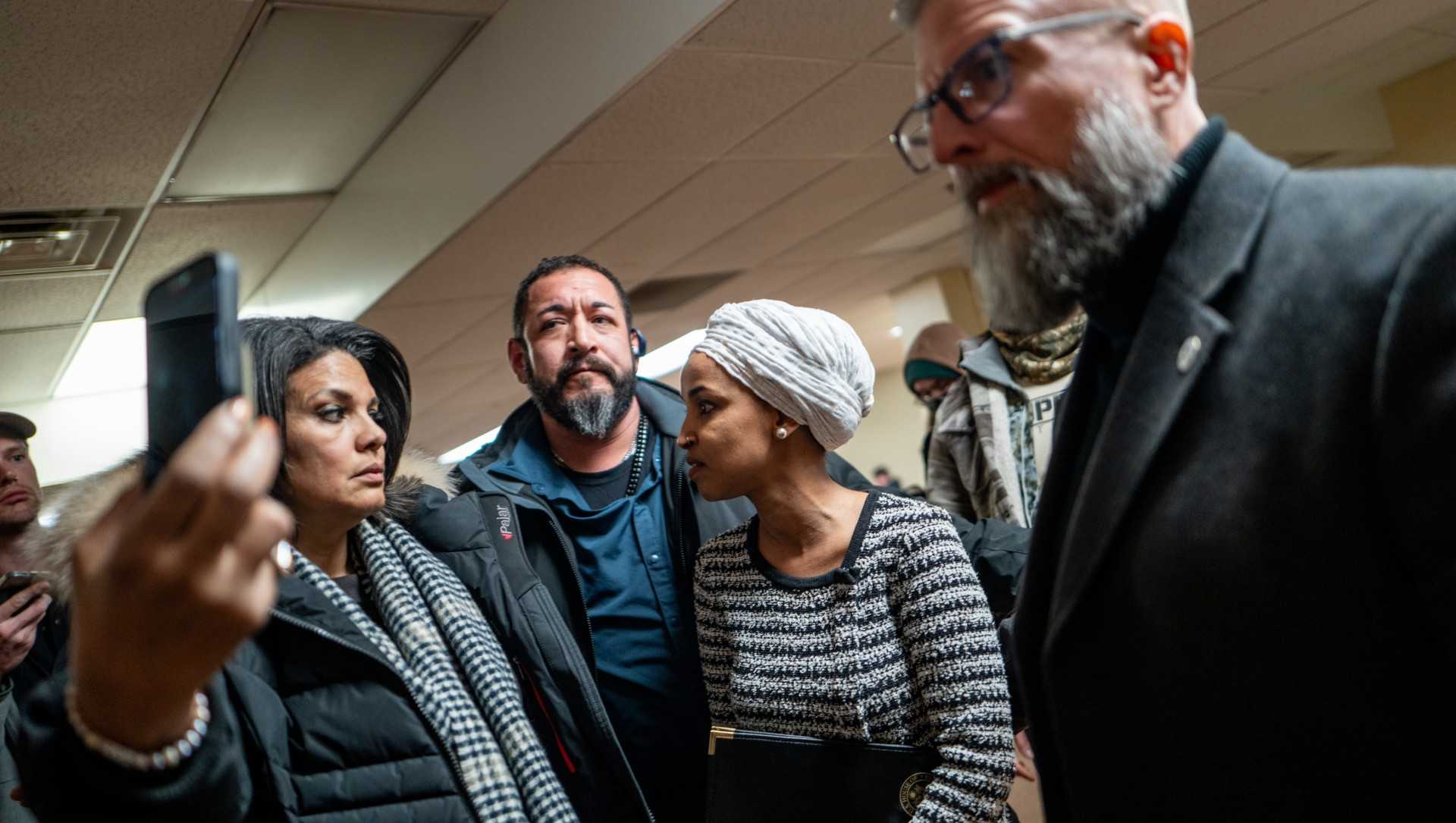 Man sprays unknown substance on Rep . Ilhan Omar and is tackled at Minneapolis town hall