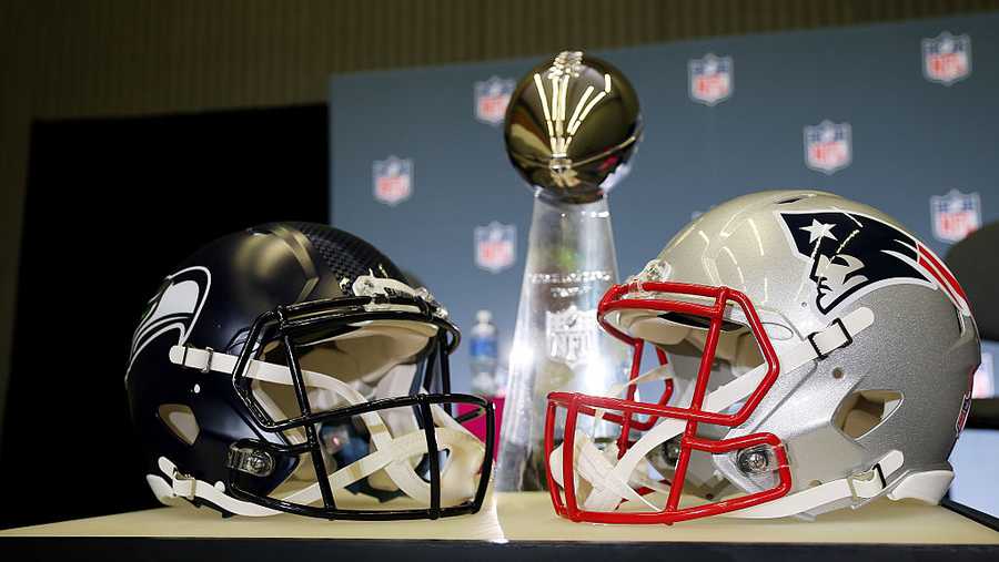 SAN JOSE, CALIFORNIA - FEBRUARY 02: The Vince Lombardi Trophy is framed by the Seattle Seahawks and New England Patriots helmets during Super Bowl LX Opening Night at San Jose McEnery Convention Center on February 02, 2026 in San Jose, California. (Photo by Chris Graythen/Getty Images)