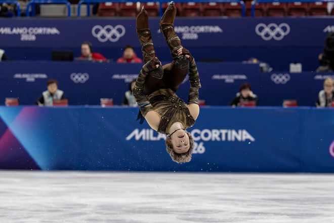 Ilia Malinin of the United States performs a back flip during his routine in the Figure Skating, Team Event, Men's Single Skating - Short Program routine at the Milano Ice Skating Arena at the Milano Cortina Winter Olympic Games 2026 on Feb. 7, 2026, in Milan, Italy.