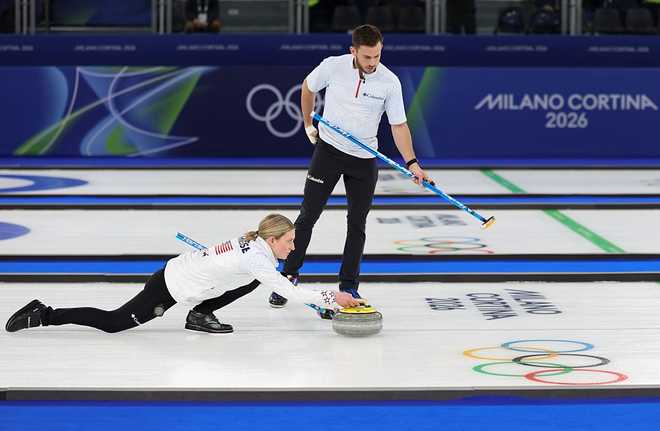 Cory Thiesse L and Korey Dropkin of the United States competes during the curling mixed doubles gold medal match between Sweden and the United States at the Milan-Cortina 2026 Olympic Winter Games in Cortina, Italy, Feb. 10, 2026. (Photo by Ding Xu/Xinhua via Getty Images)