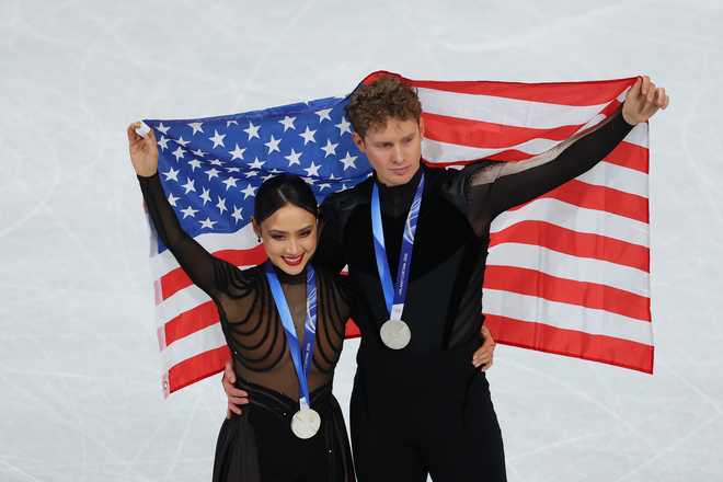 Silver medalists Madison Chock and partner Evan Bates of Team United States pose for a photo after the medal ceremony for Ice Dance on day five of the Milano Cortina 2026 Winter Olympic Games at Milano Ice Skating Arena on Feb. 11, 2026, in Milan, Italy.
