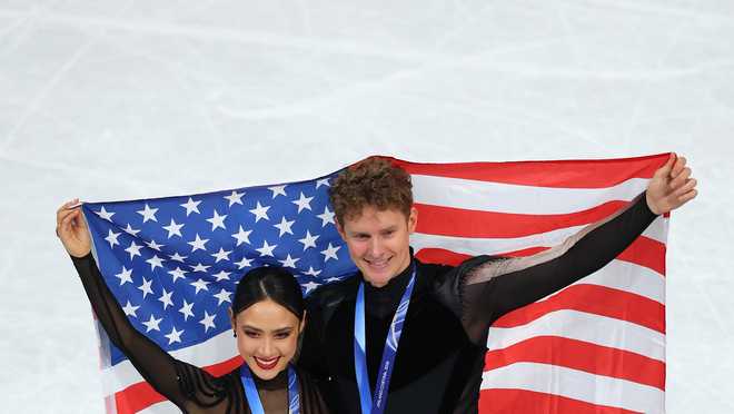 Silver medalists Madison Chock and partner Evan Bates of Team United States pose for a photo after the medal ceremony for Ice Dance on day five of the Milano Cortina 2026 Winter Olympic Games at Milano Ice Skating Arena on February 11, 2026, in Milan, Italy.