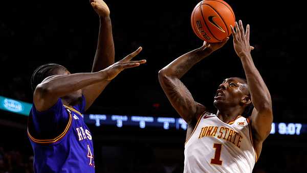 AMES, IOWA - FEBRUARY 14: Jamarion Batemon #1 of the Iowa State Cyclones takes a shot as Flory Bidunga #40 of the Kansas Jayhawks defends in the first half of play at Hilton Coliseum on February 14, 2026 in Ames, Iowa. (Photo by David K Purdy/Getty Images)