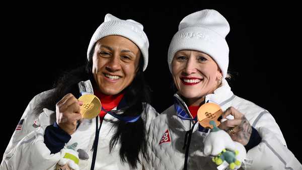 Gold medallist USA's Elana Meyers Taylor and bronze medallist USA's Kaillie Armbruster Humphries pose on the podium of the bobsleigh women's monobob at Cortina Sliding Centre during the Milano Cortina 2026 Winter Olympic Games in Cortina d'Ampezzo on Feb. 16, 2026.