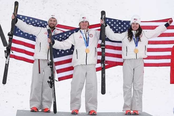 Gold medalists Christopher Lillis of Team United States, Connor Curran of Team United States and Kaila Kuhn of Team United States pose for a photo during the medal ceremony for the Mixed Team Aerials Final on Day 15 of the Milan Cortina 2026 Winter Olympic Games at Livigno Air Park on February 21, 2026, in Livigno, Italy.