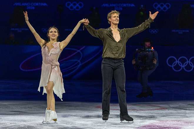 MILAN, ITALY - February 21: Madison Chock and Evan Bates of the United States react after performing their routine during the Olympic Figure Skating Exhibition Gala at the Milano Ice Skating Arena at the Milano Cortina Winter Olympic Games 2026 on February 21st, 2026 in Milan, Italy.  (Photo by Tim Clayton/Getty Images)