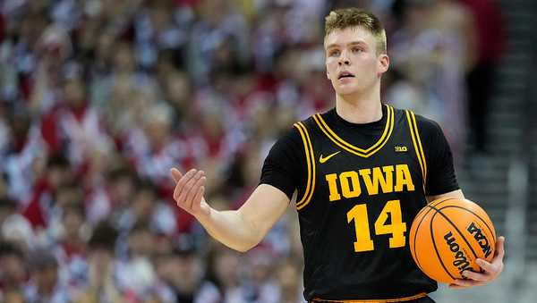 MADISON, WISCONSIN - FEBRUARY 22: Bennett Stirtz #14 of the Iowa Hawkeyes dribbles up court during the first half against the Wisconsin Badgers at Kohl Center on February 22, 2026 in Madison, Wisconsin. (Photo by John Fisher/Getty Images)