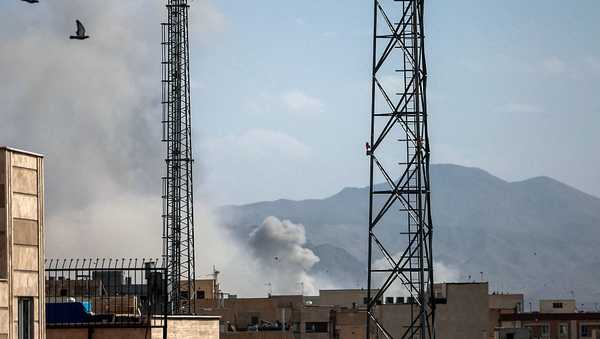 A plume of smoke rises following a reported explosion in Tehran on February 28, 2026. Iran said on February 28 it will "respond decisively" after Israel and the United States launched strikes on the country despite talks underway on Tehran's nuclear programme. (Photo by AFP via Getty Images)