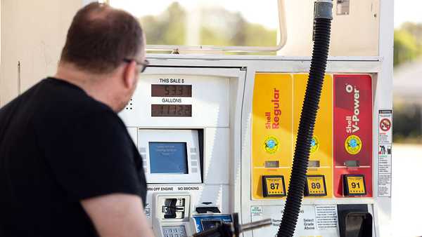 A man pumps gasoline into his vehicle at a gas station in Los Angeles, California on March 2, 2026. Energy prices surged on March 2 as the war in the Middle East led to outages of key energy production operations. In parallel, energy markets are also absorbing a de facto halt to traffic in the Strait of Hormuz, through which about 20 percent of global supply of oil and liquid natural gas travel.  The waterway has not technically been closed, but major maritime companies have suspended travel through it as insurance costs soar amid heightened risk. (Photo by Patrick T. Fallon / AFP via Getty Images)
