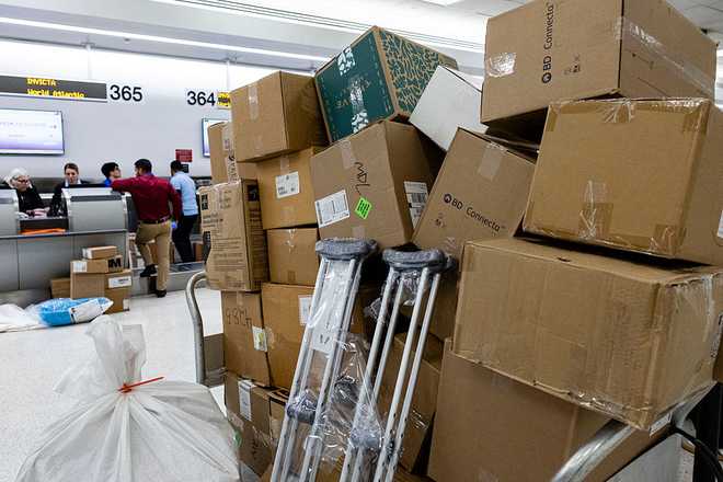 Boxes of medical supplies from the Nuestra America Convoy sit on carts awaiting check-in and loading at Miami International Airport in Miami, Florida, on March 20, 2026, ahead of the delegation traveling to Cuba with humanitarian aid. The group will bring 6,300 pounds of medicine and medical supplies to Cuba, who is experiencing shortages. Cuba has been mired in an economic crisis exacerbated by the sudden suspension of oil supplies from Venezuela in January after the United States ousted president Nicolas Maduro, a Cuba ally. (Photo by Eva Marie UZCATEGUI / AFP via Getty Images)