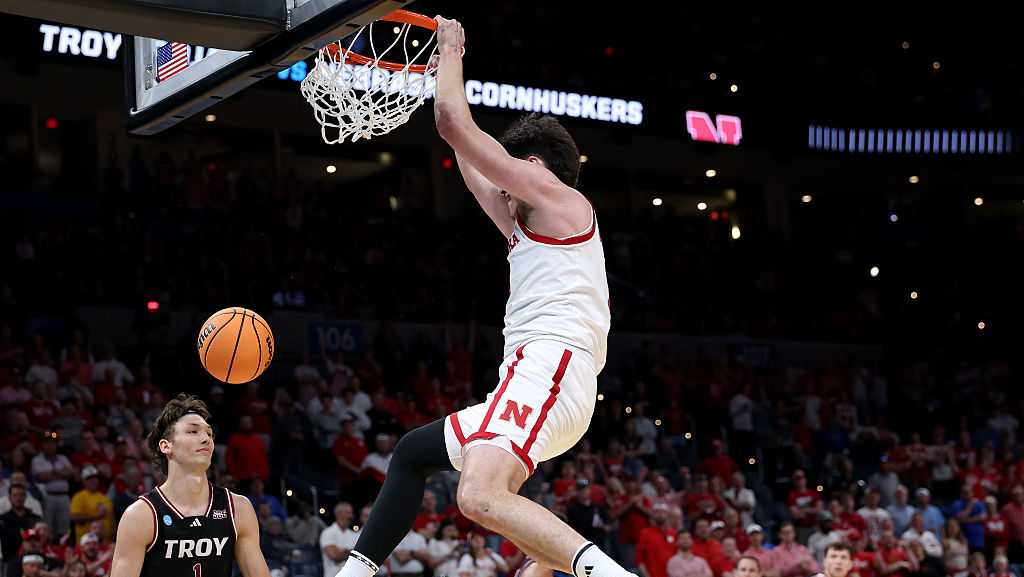Nebraska Athletic Director Troy Dannen reacts to Husker basketball's first ever March Madness win